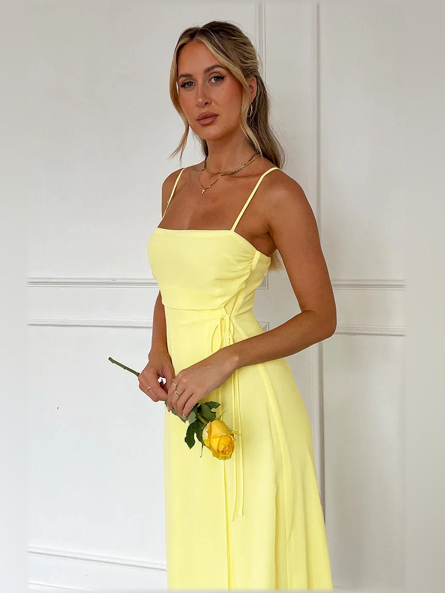 Yellow spaghetti strap A-line formal dress with waist tie and side drape