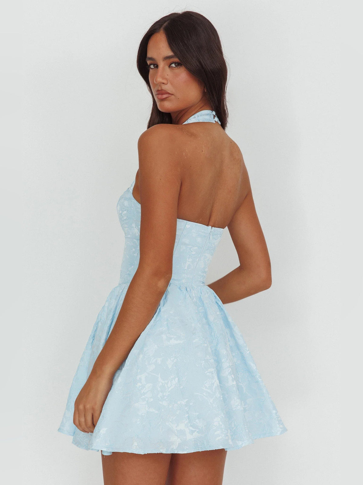 Blue halter mini dress back view with flared tiered skirt