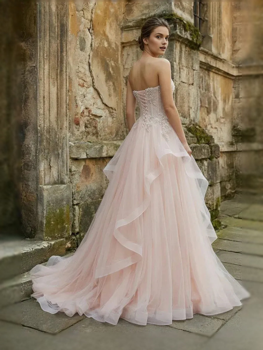Blush pink sweetheart corset ball gown with layered tulle skirt and embroidered bodice