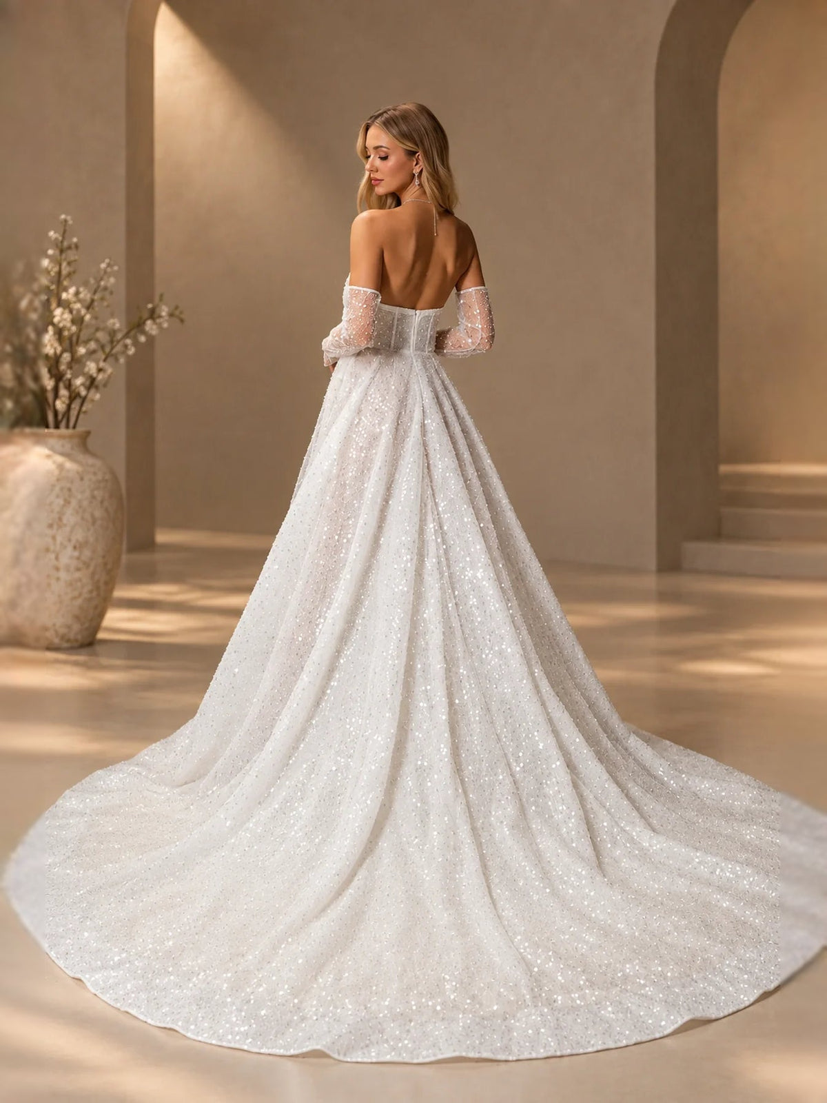 Ivory strapless corset A-line wedding dress from back view with long sheer sleeves