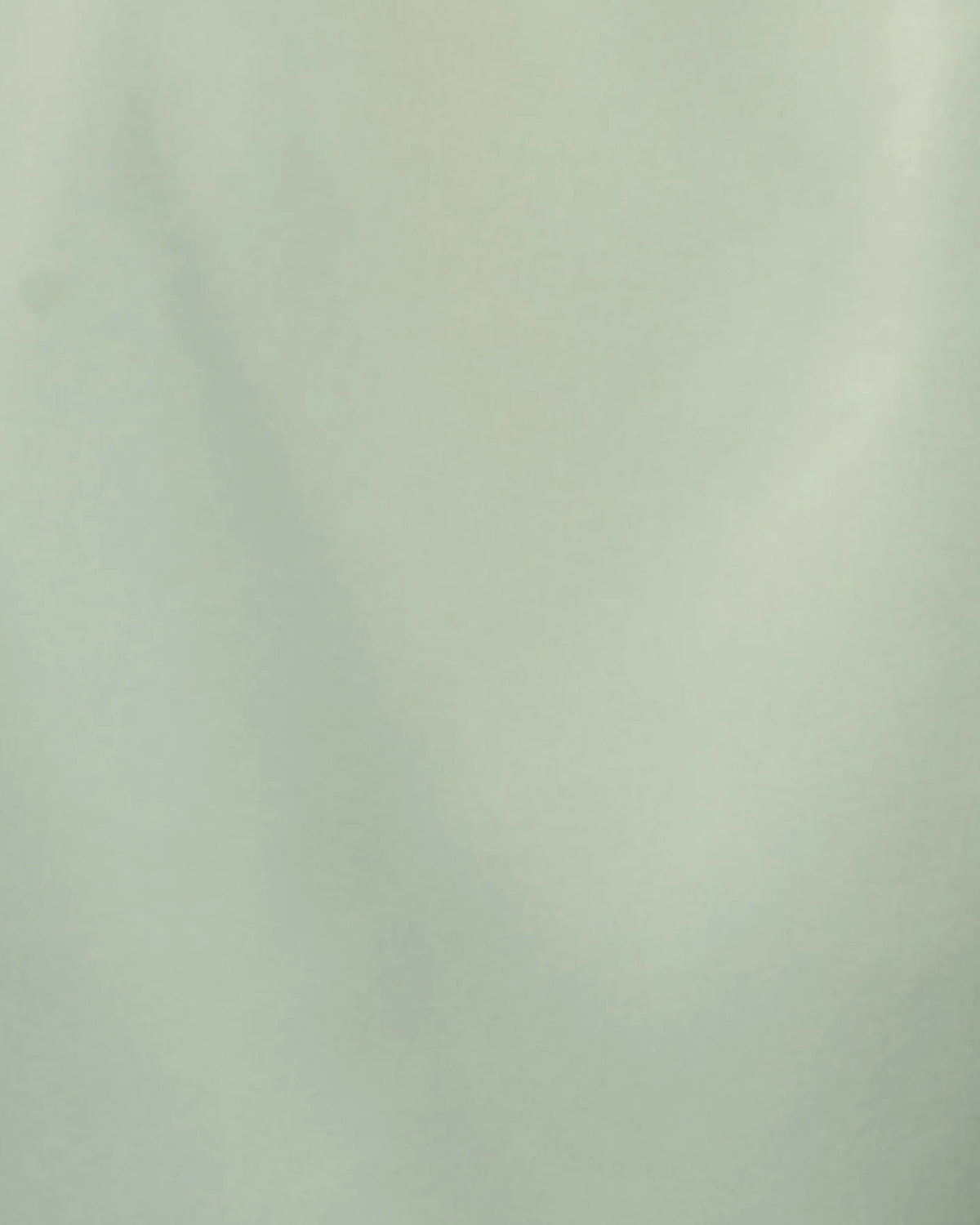 Mint green satin-like fabric swatch with smooth drape texture