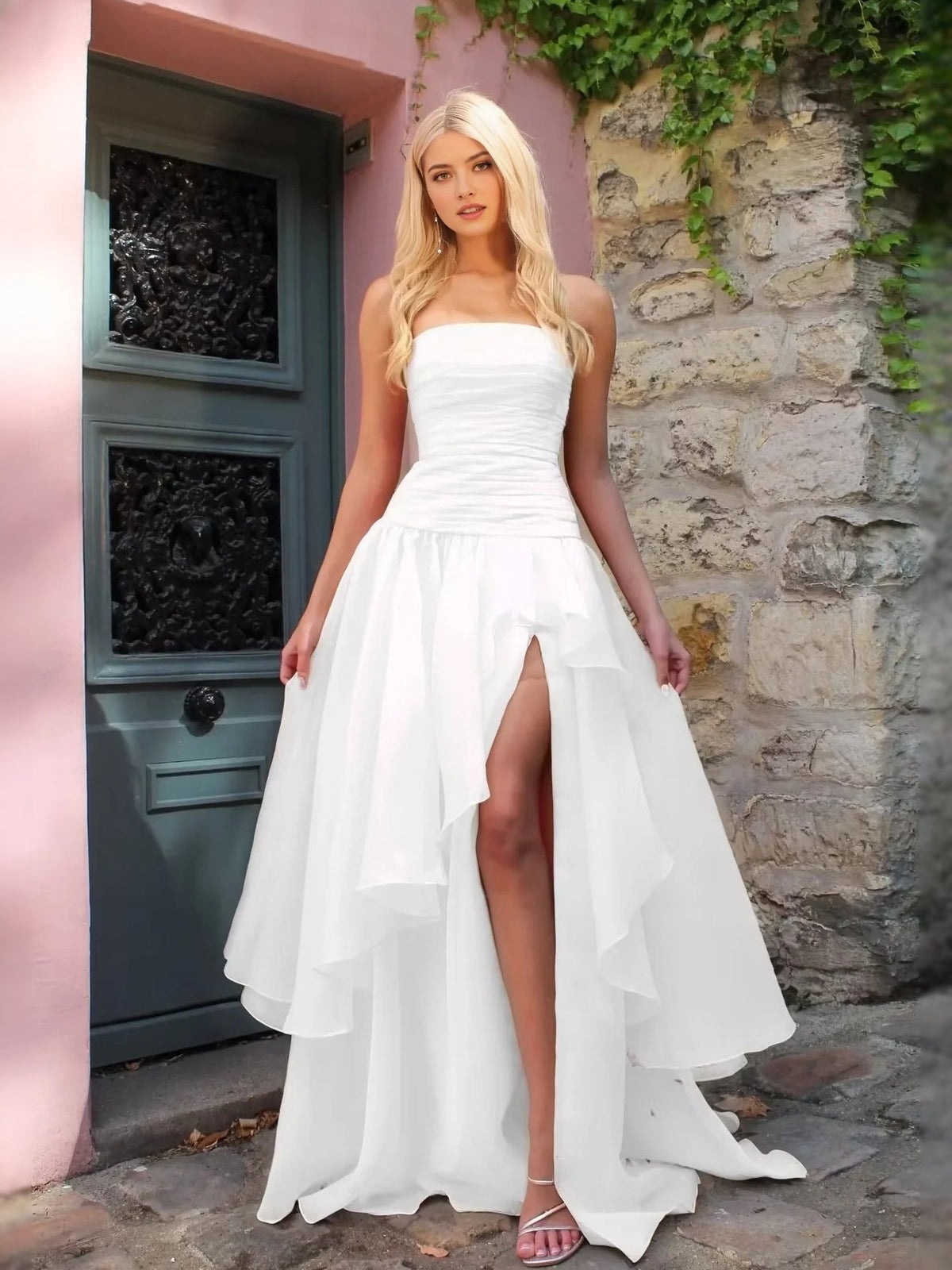 White strapless ruched prom dress with layered A-line high-low skirt and front slit