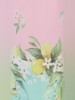 Closeup of pastel lemon and floral print fabric with striped ribbon trim