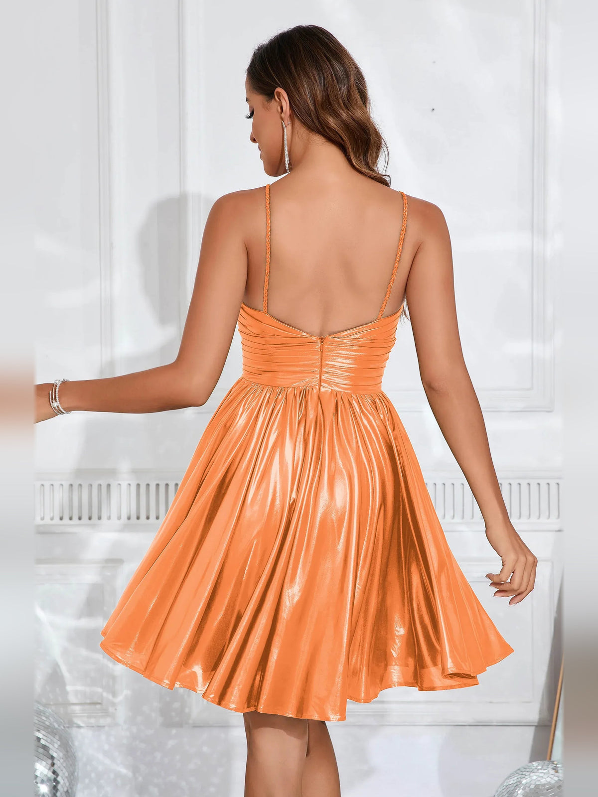 Orange metallic A-line homecoming dress, open-back with thin straps, ruched bodice, pleated skirt