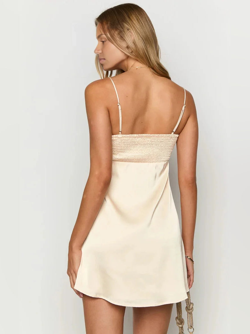 Ivory white satin mini dress back view, thin straps with textured ruched center