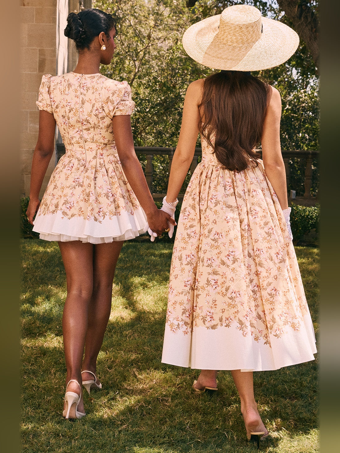 Floral print pleated mini dress back view with puff sleeves and layered white hem