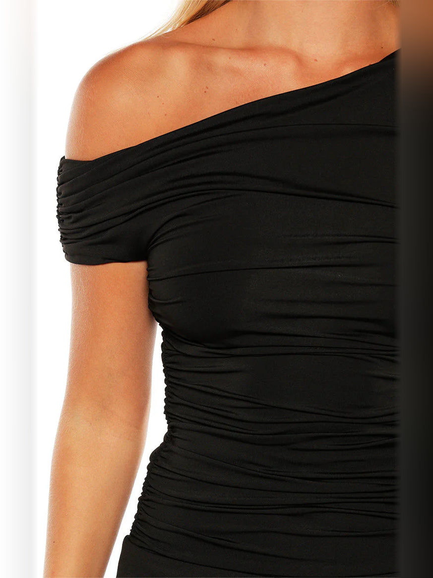Close-up of black off-shoulder ruched bodice with draped neckline detail
