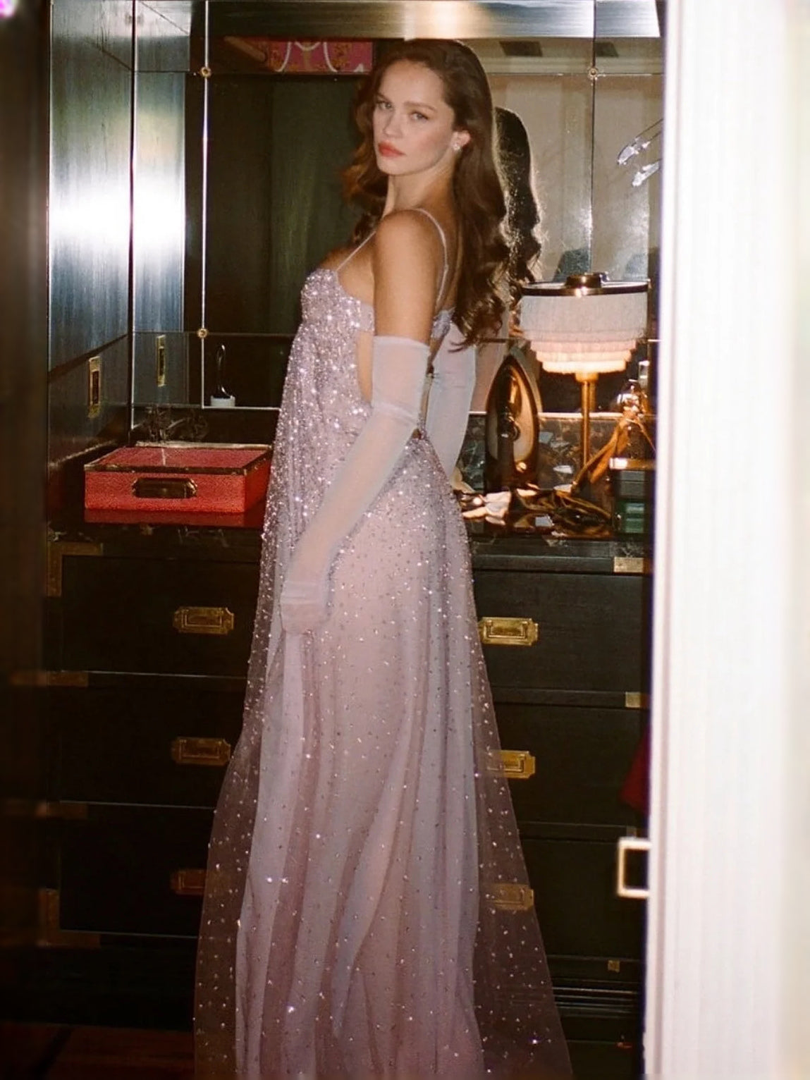 Dusty rose beaded tulle prom dress, side view with thin straps and open back
