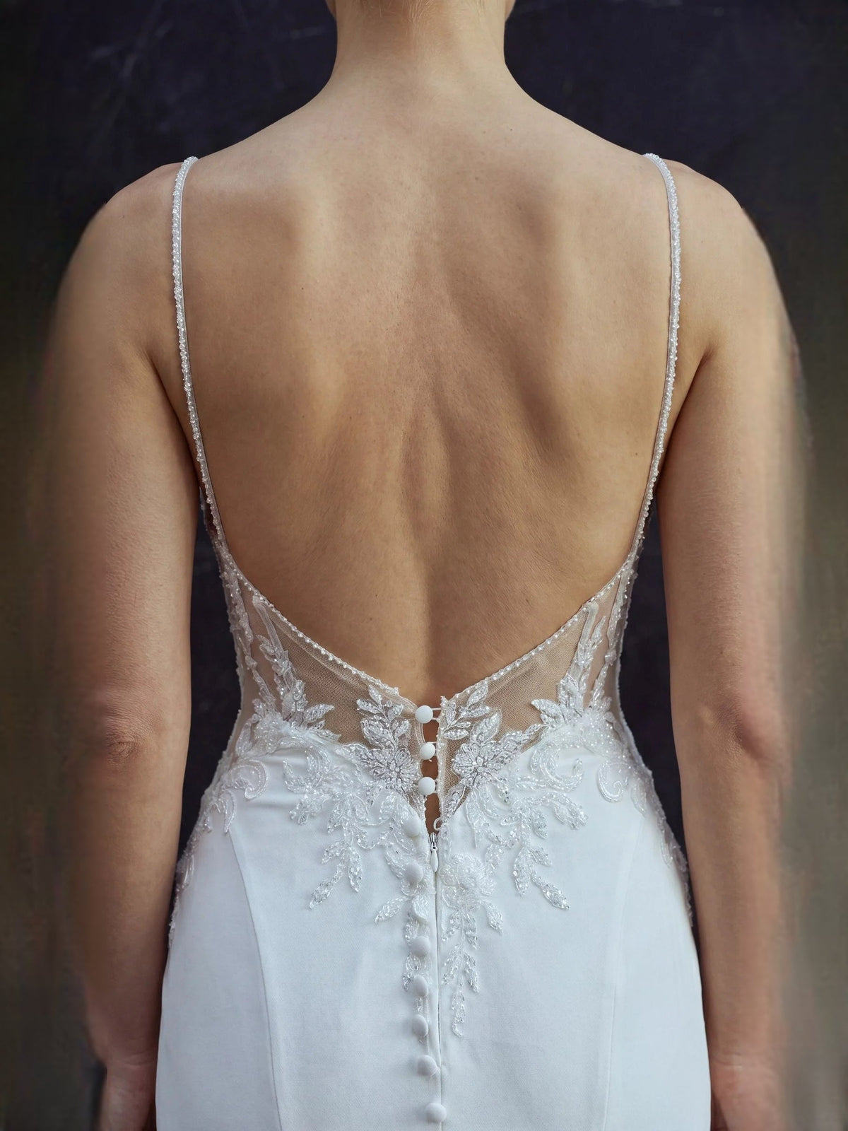 White lace mermaid wedding dress back with thin straps and V-shaped back detail