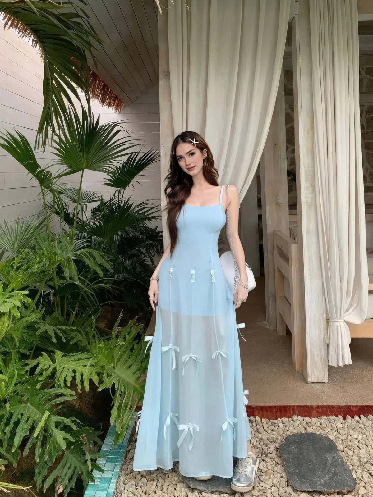 Light blue A-line maxi prom dress with spaghetti straps, scoop neck, bow appliques