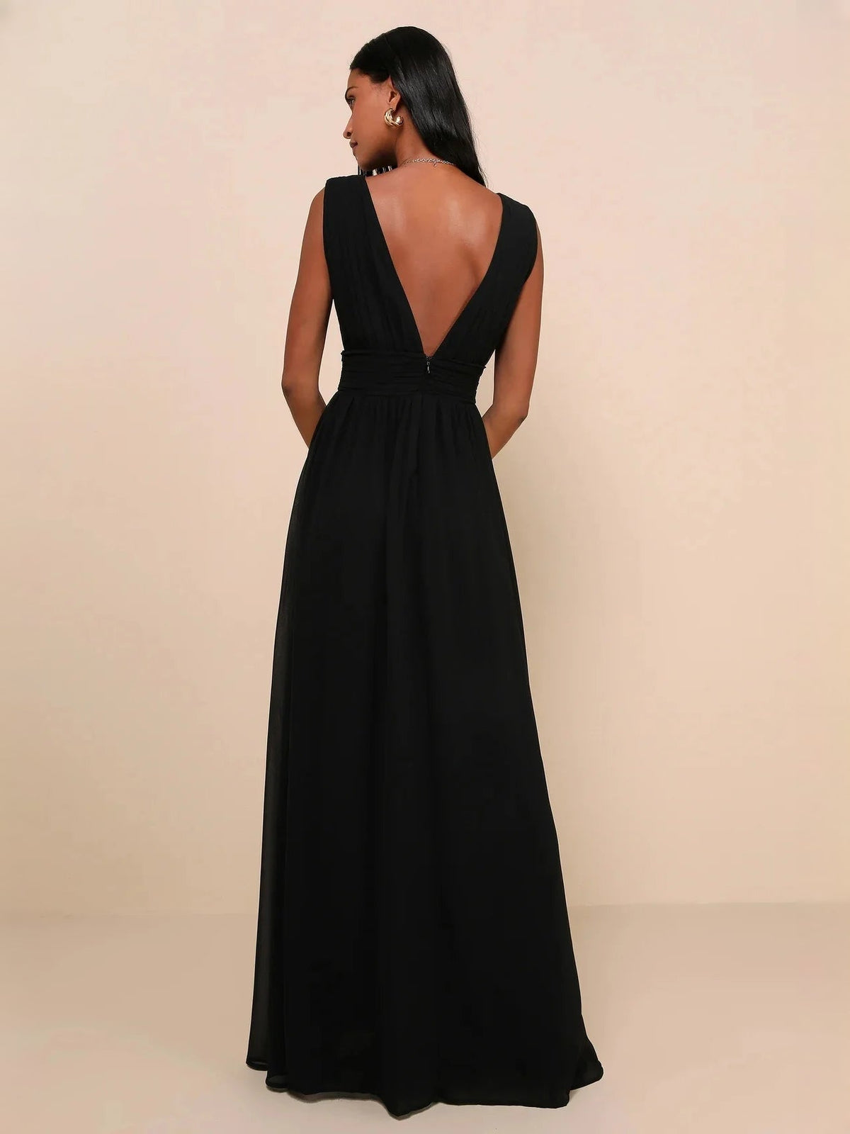 Black backless A-line maxi dress with V-neck front, ruched waist, and full skirt