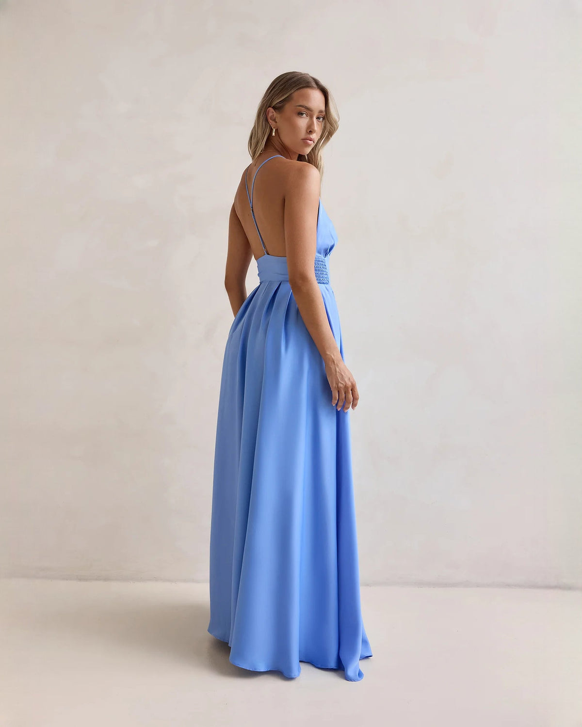Periwinkle blue chiffon A-line maxi dress side view with thin straps and front slit