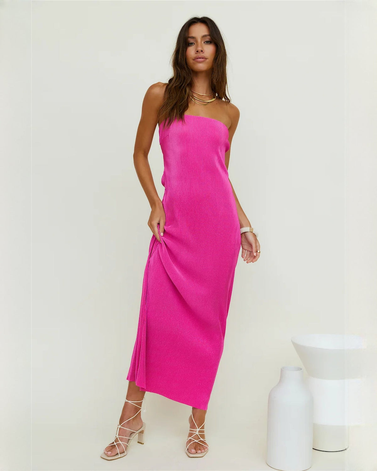 Hot pink strapless satin maxi dress with draped A-line skirt and side ruching