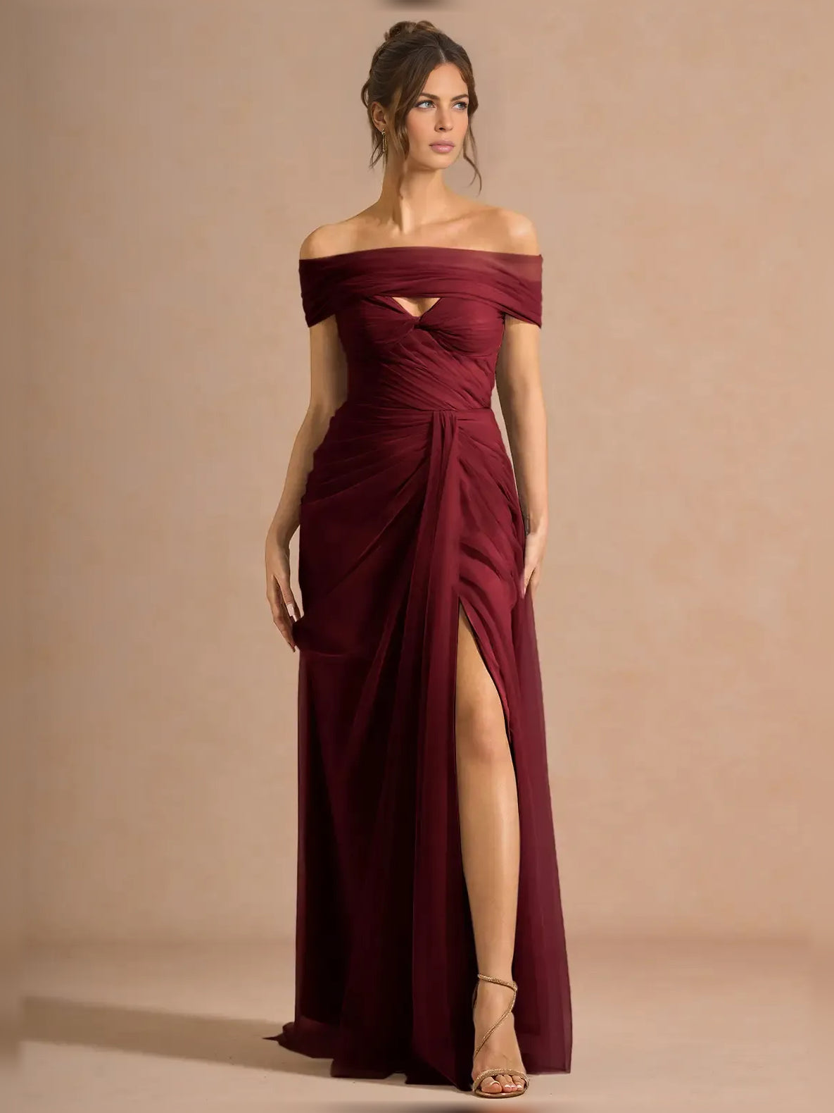 Off-shoulder formal dress in burgundy with ruched bodice and front slit