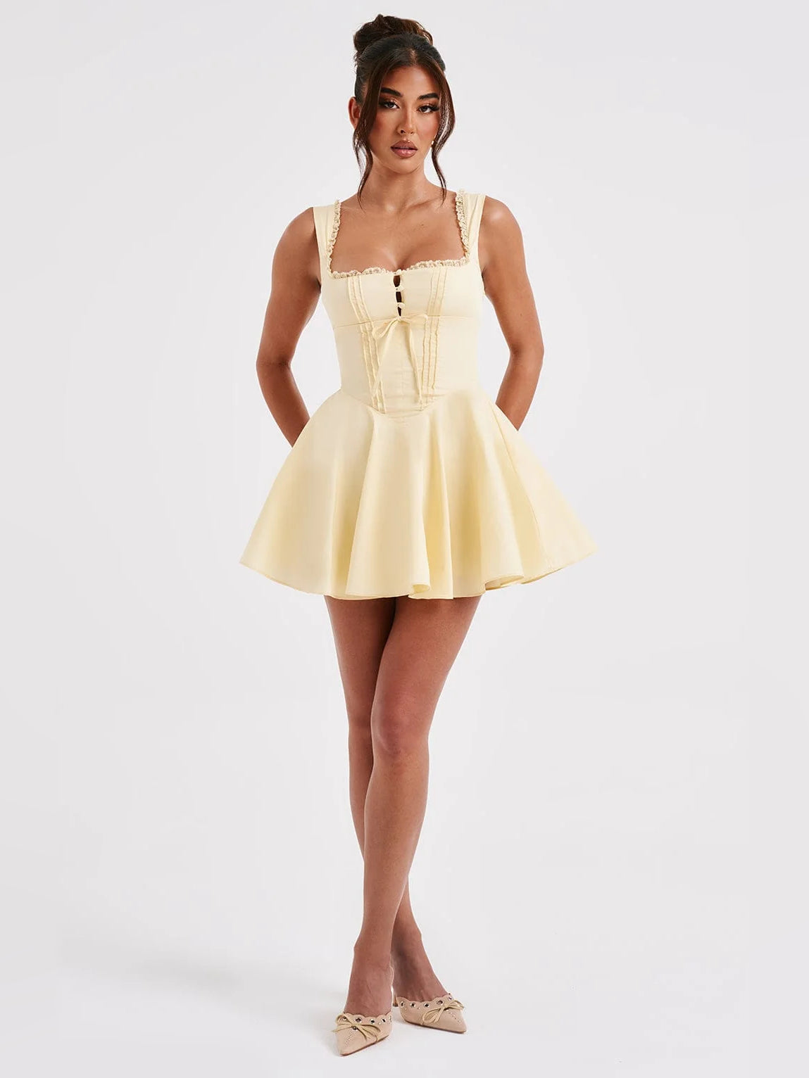 Lemon yellow mini dress standing pose, sweetheart bodice with lace trim and flared skirt