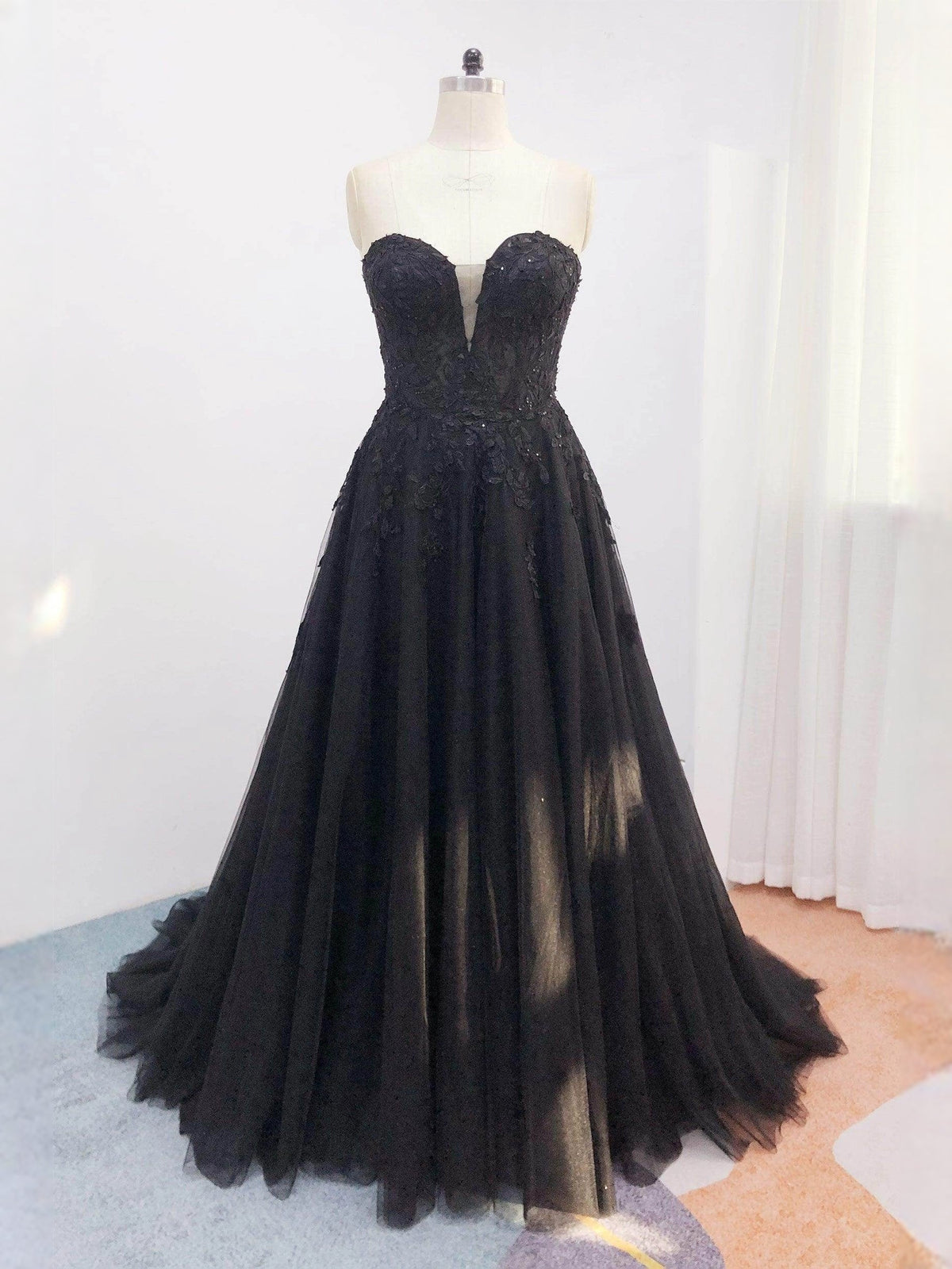 Black glitter A-line wedding dress with V-neck bodice and layered tulle skirt