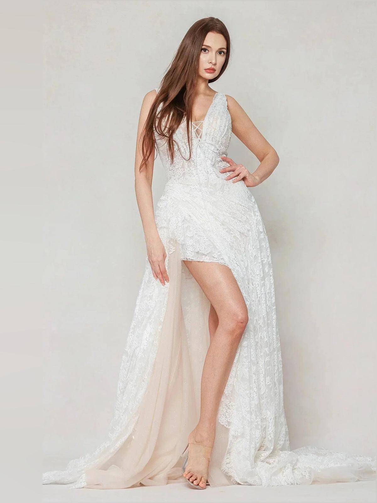 Ivory lace V-neck sleeveless wedding dress with thigh-high slit and long train