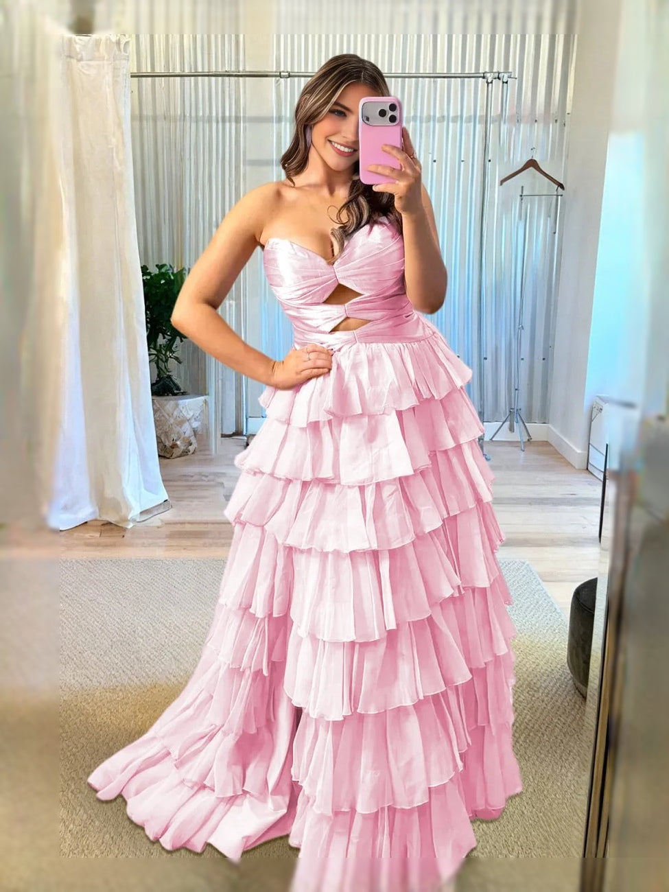 Light pink strapless sweetheart ruffle prom dress with corset cut-out bodice and tiered skirt