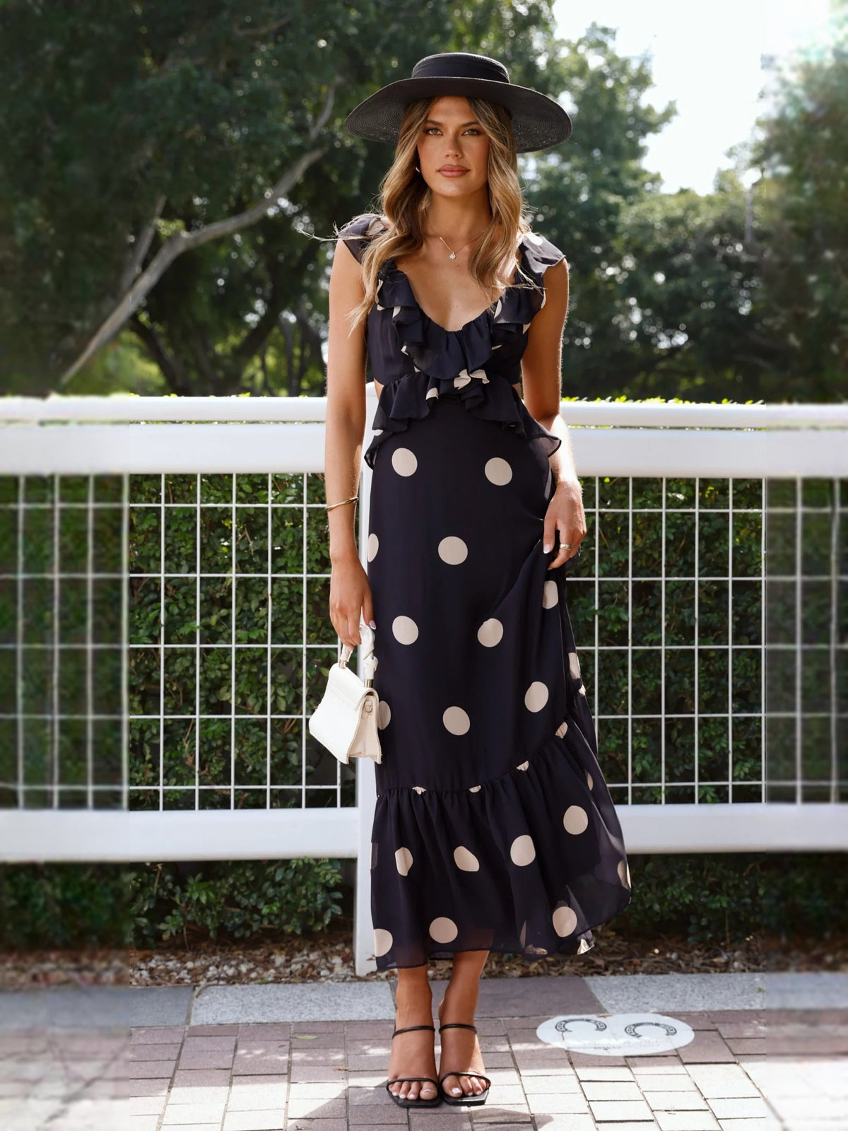 Black polka-dot midi formal dress with V-neck ruffles and tiered hem