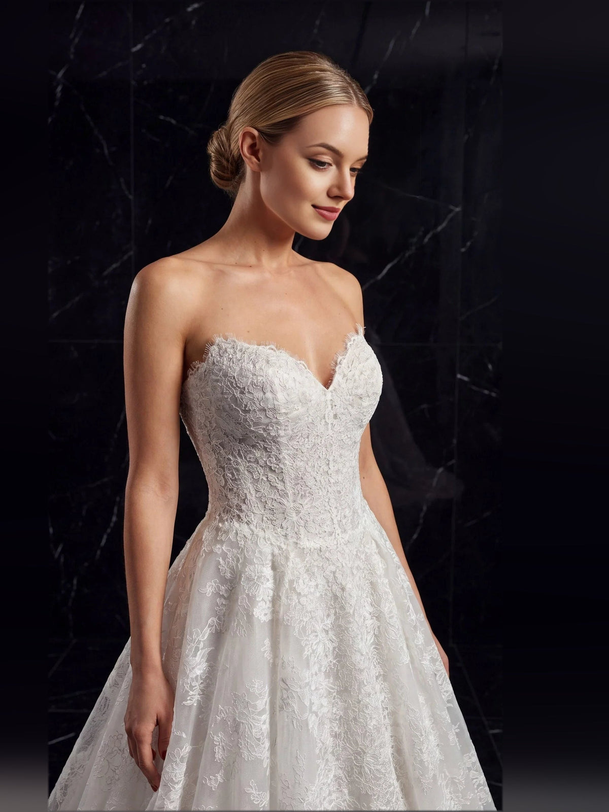 Ivory strapless tulle A-line wedding dress with sweetheart neckline and textured lace