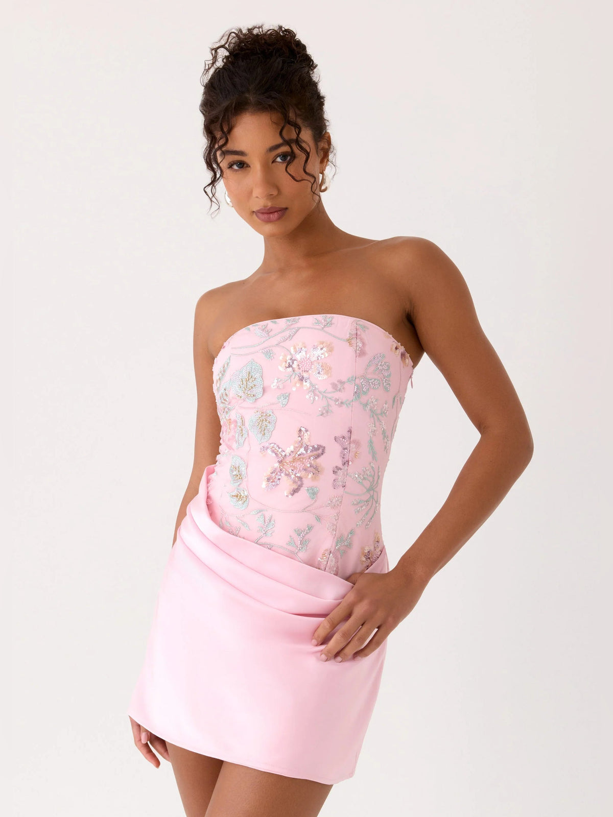 Pink strapless mini dress with beaded floral bodice and fitted ruched waist