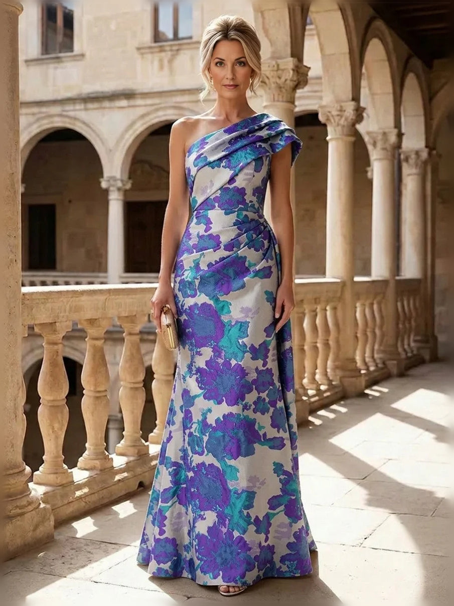 Blue-purple floral one-shoulder mermaid gown with ruched drape, floor-length.