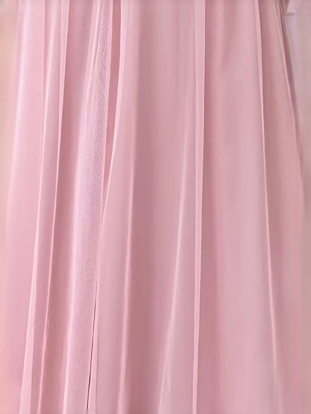 Close-up of light pink pleated tulle skirt fabric