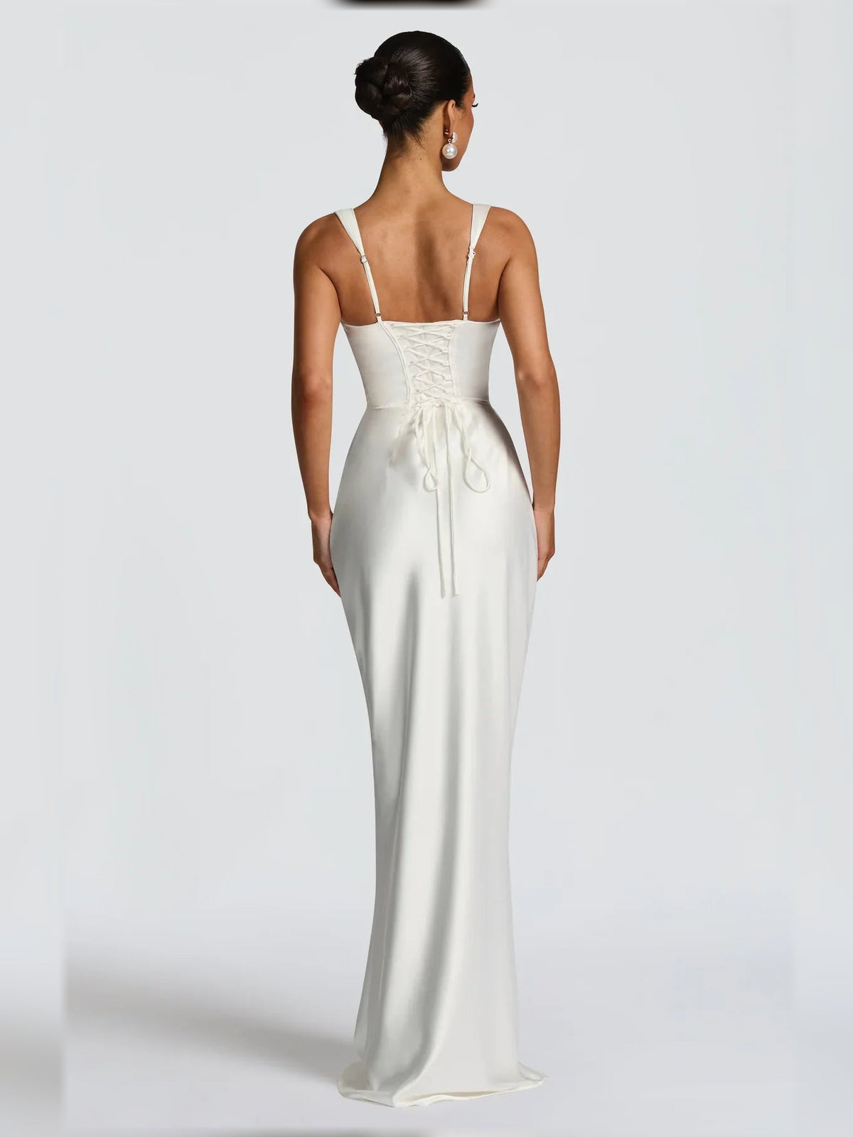 White corset formal dress with scoop back straps and floor-length satin skirt