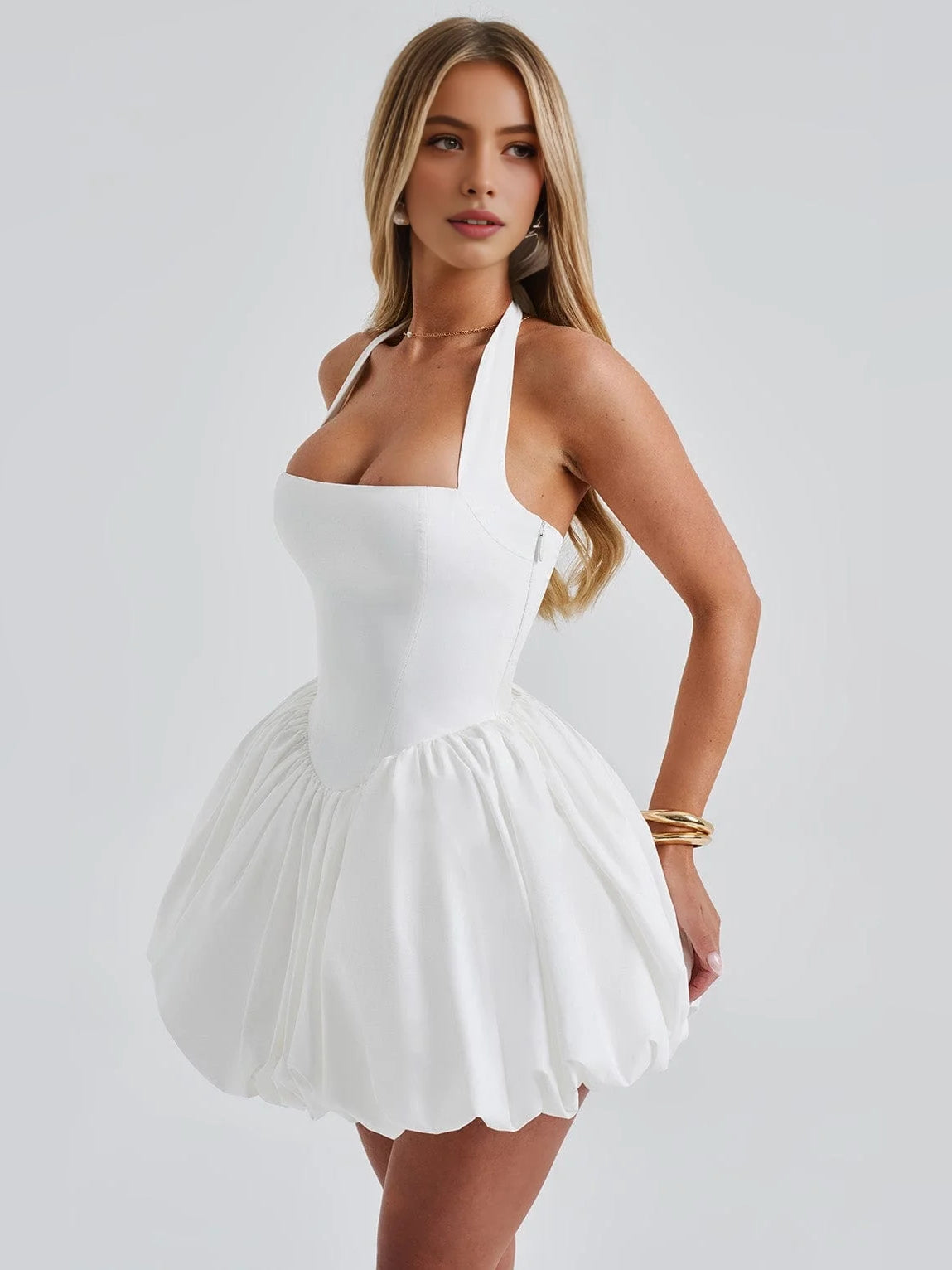 White corset halter mini dress with bow strap and flared pleated skirt