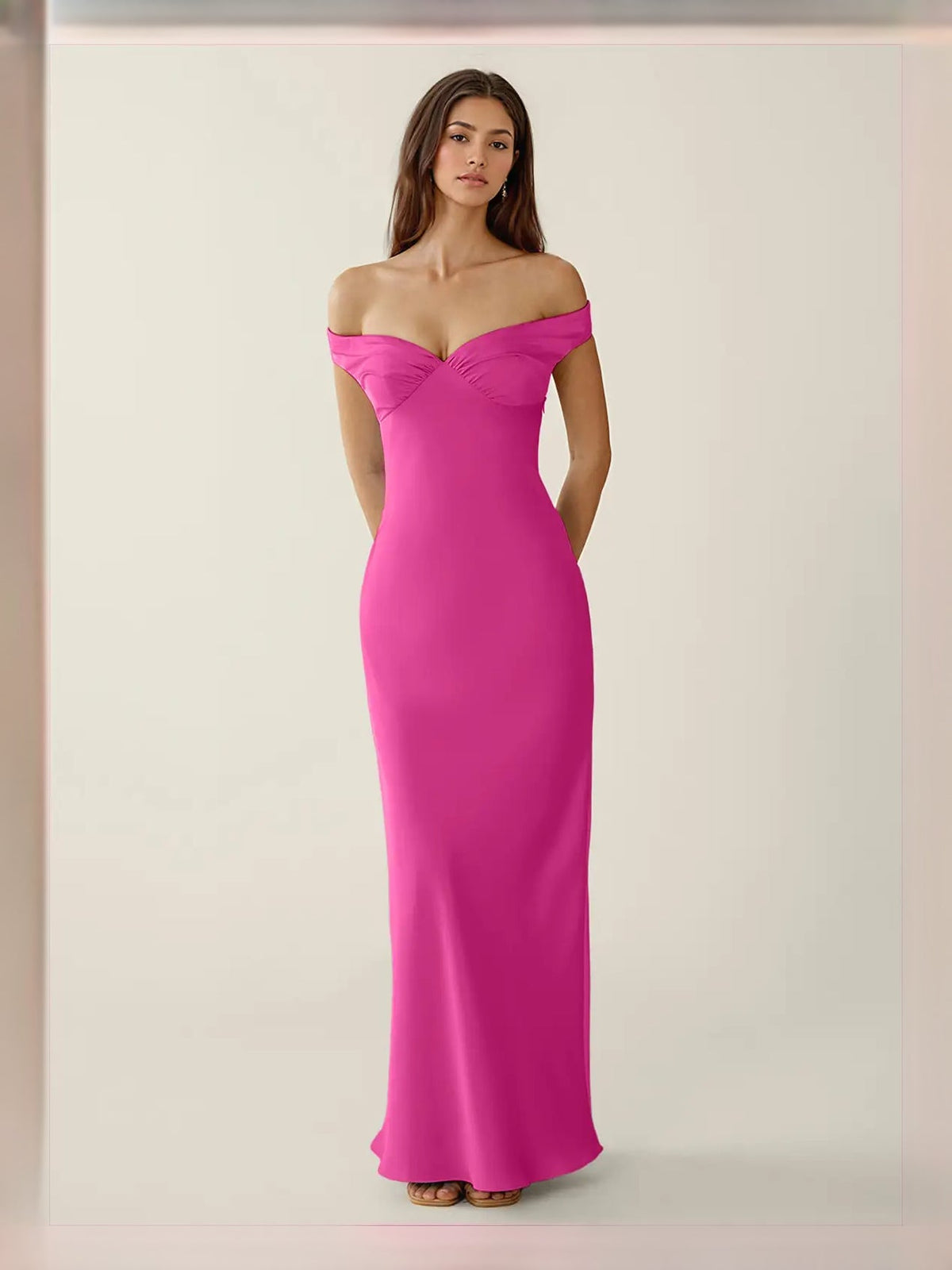 Hot pink off-shoulder satin maxi dress with fitted column shape and sweetheart neckline