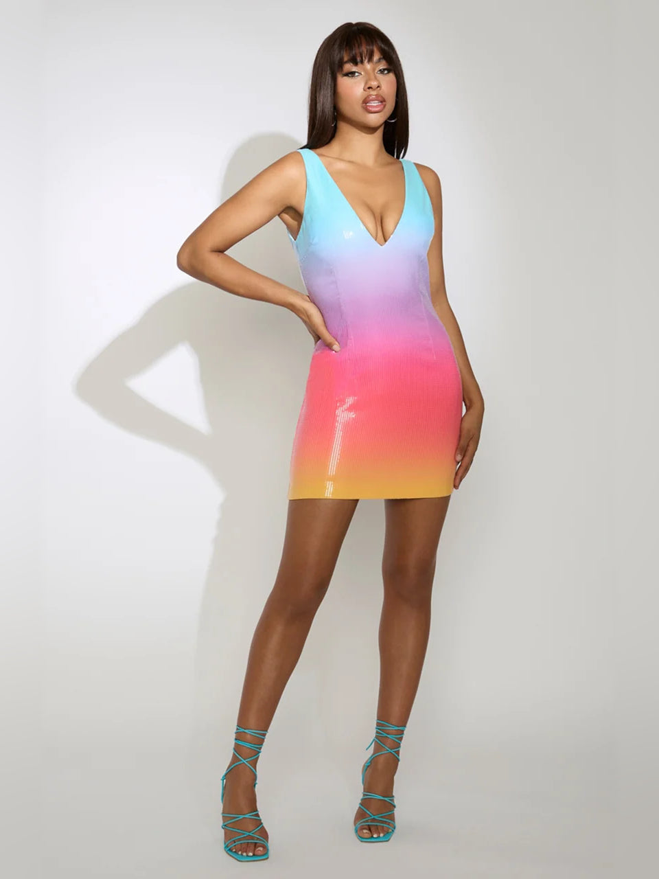 Rainbow gradient sequin mini dress, sleeveless V-neck, fitted silhouette