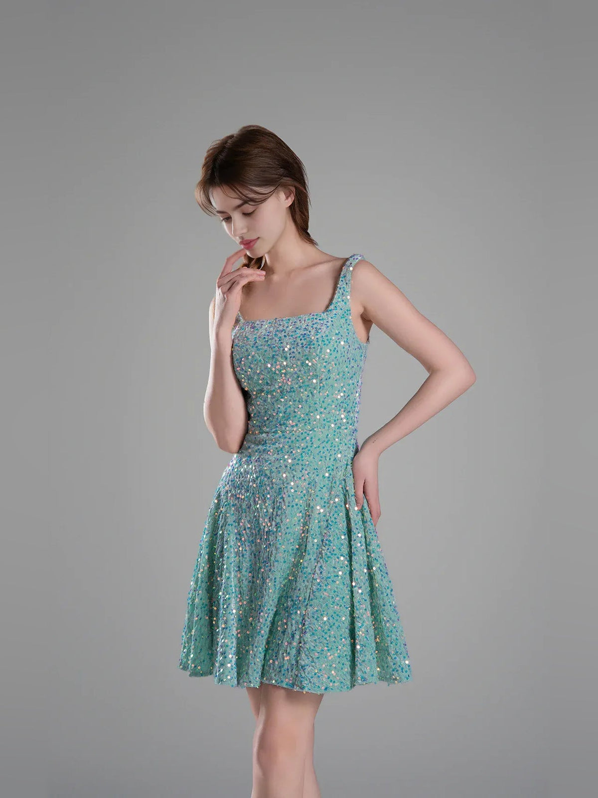 Turquoise sequined A-line mini dress with square neckline and spaghetti straps