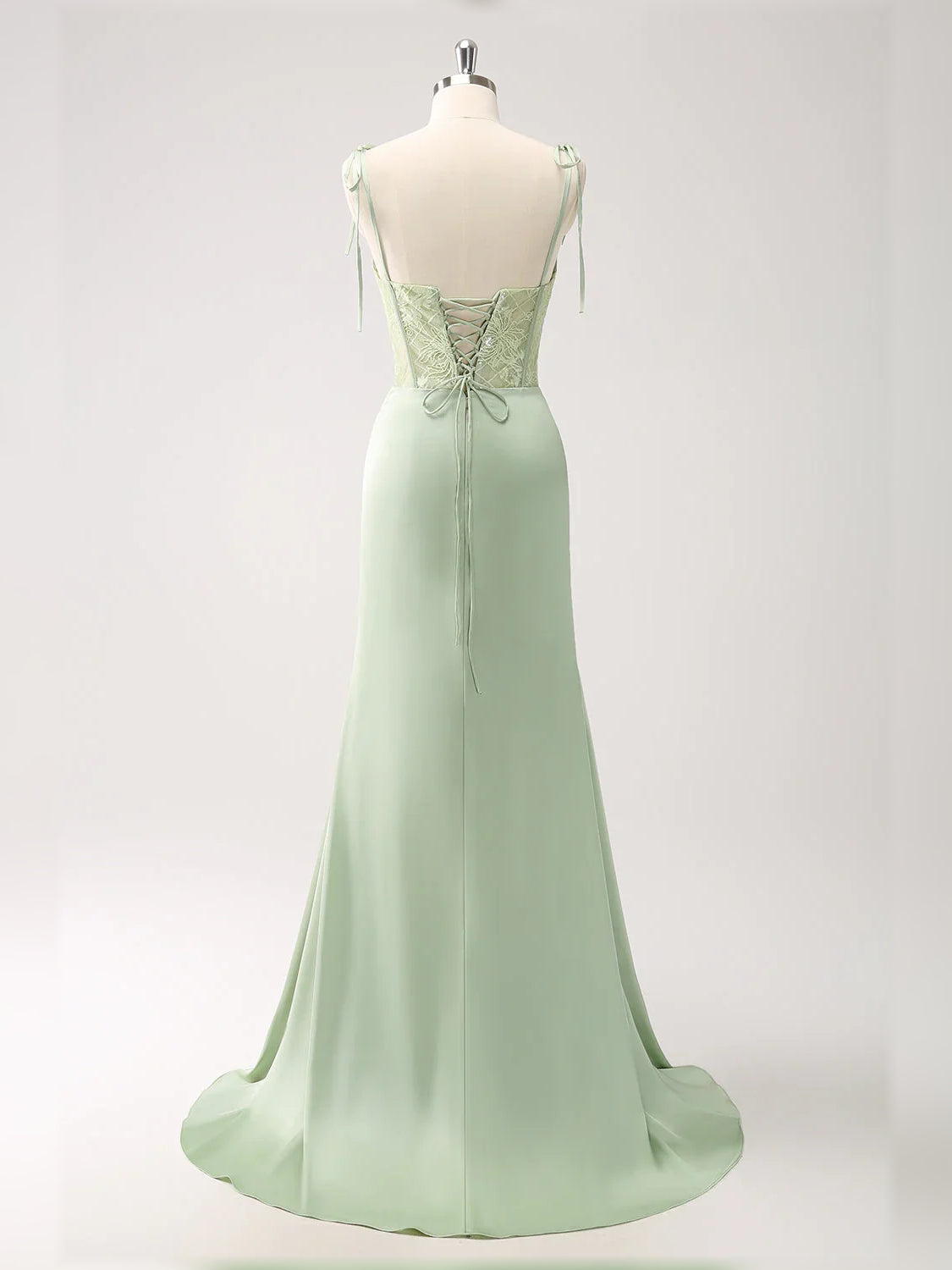 Celadon green V-back corset formal dress with lace bodice and flowing skirt