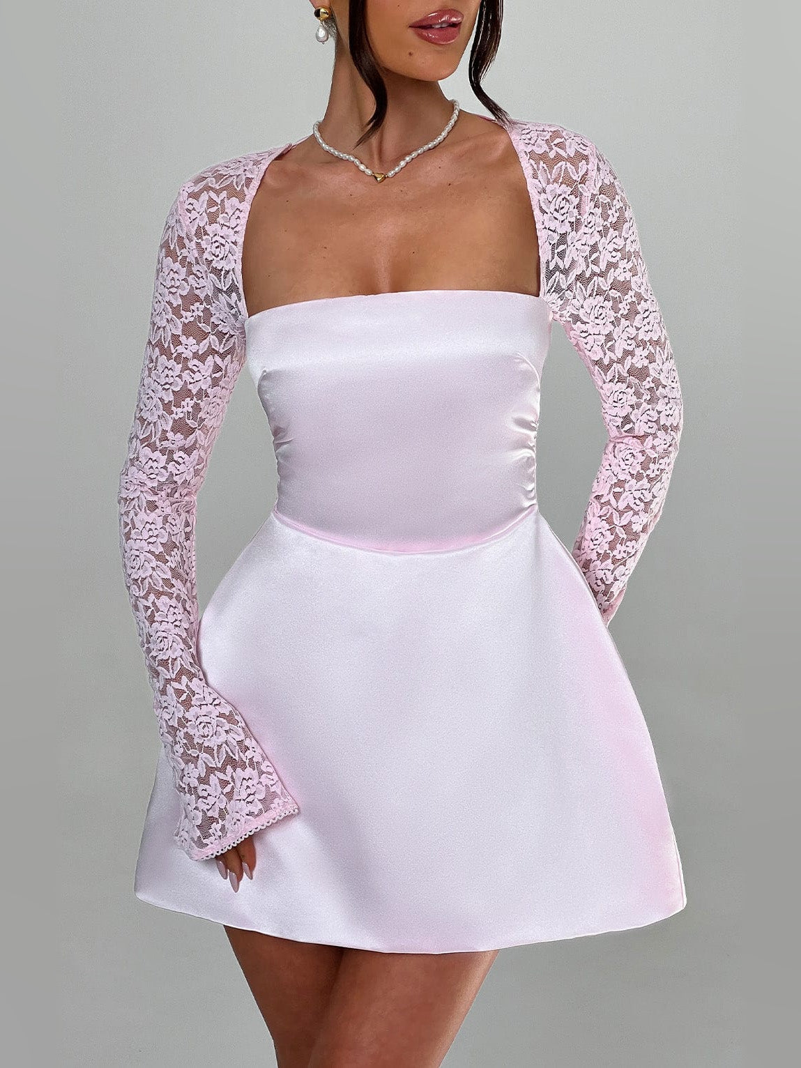 Blush satin mini dress with long lace sleeves and sweetheart neckline