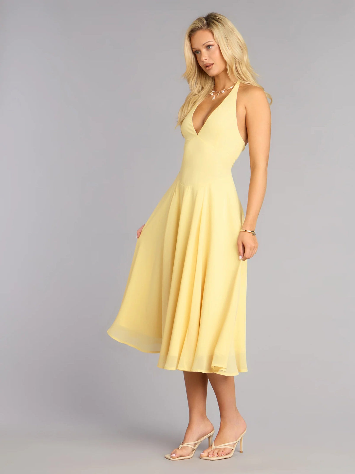 Yellow chiffon midi formal dress with V-neck halter and airy flared hem
