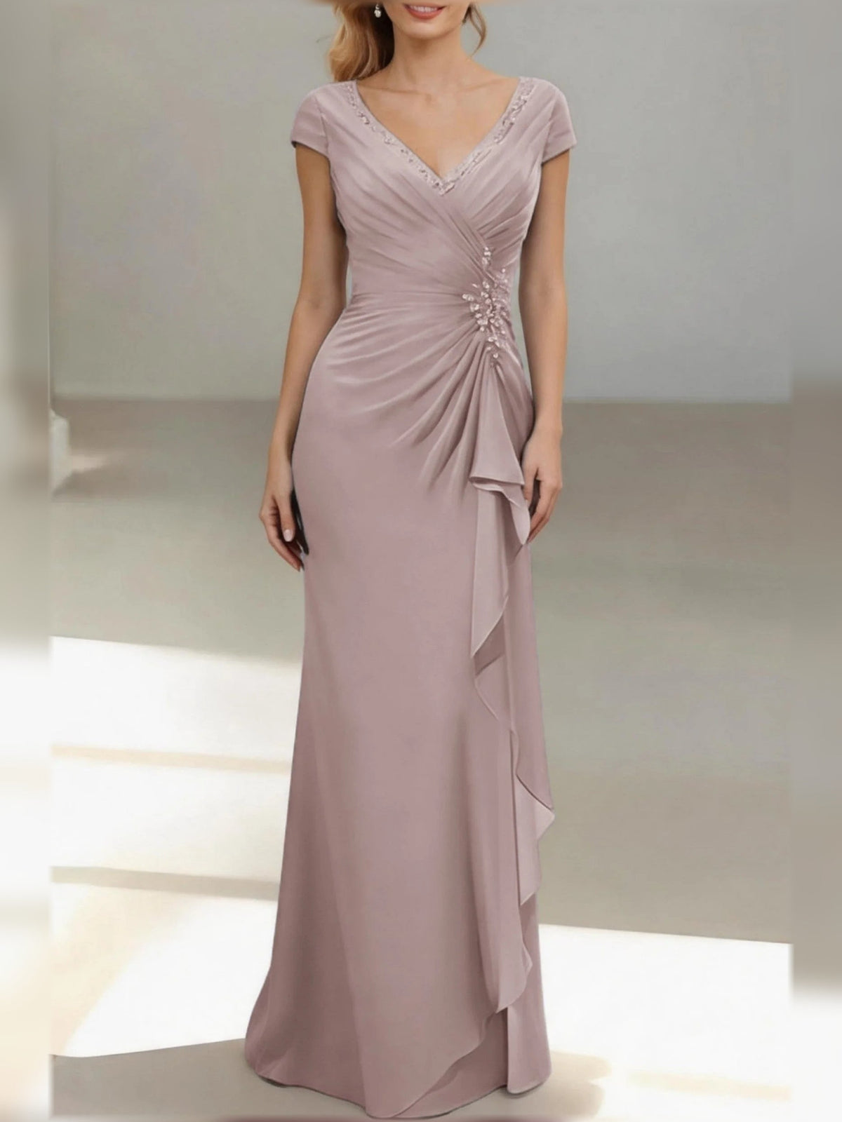 Dusty rose V-neck ruched mermaid gown with cap sleeves and draped ruffle skirt