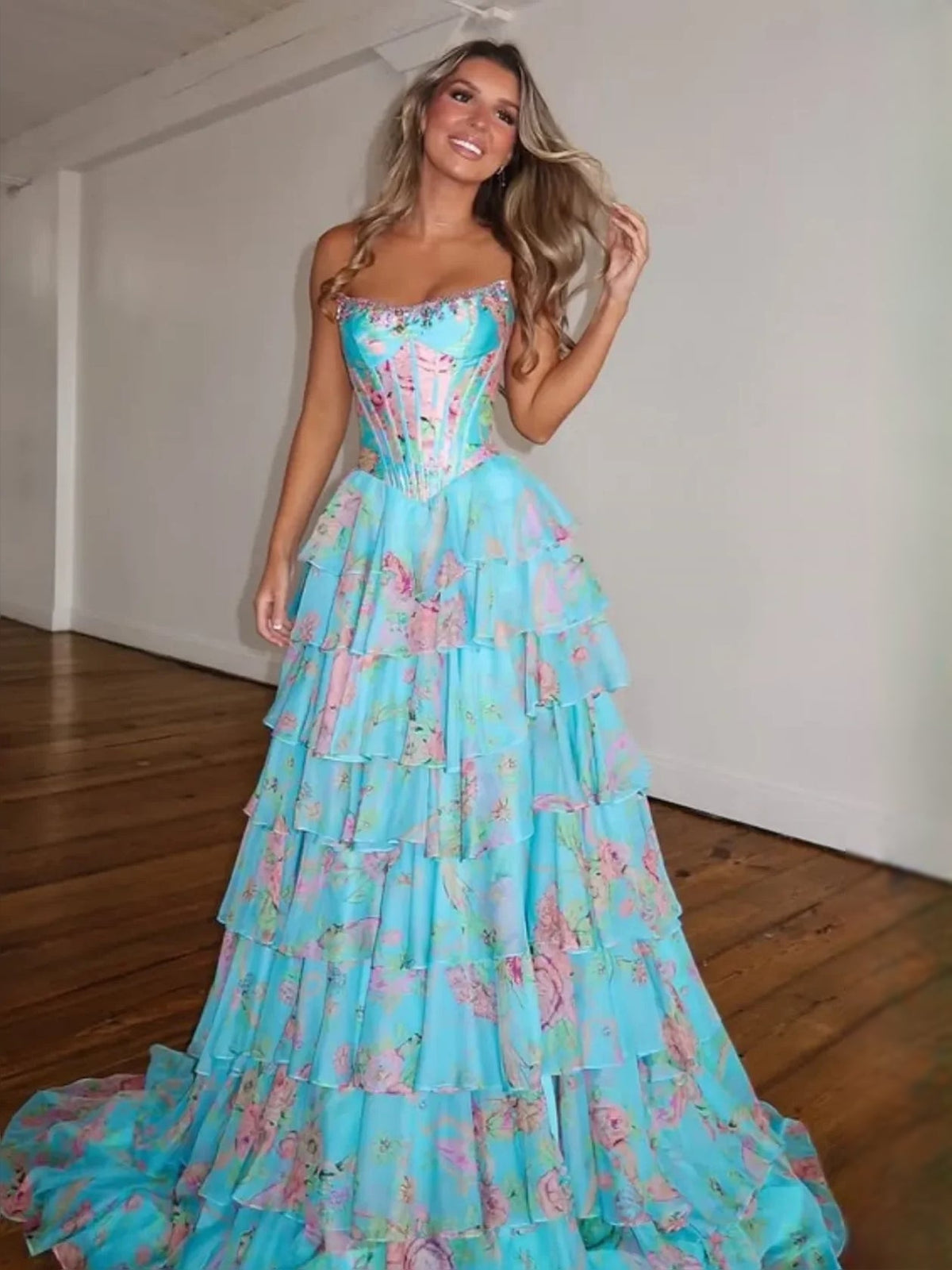 Turquoise floral tiered ruffle strapless A-line prom dress with layered skirt.