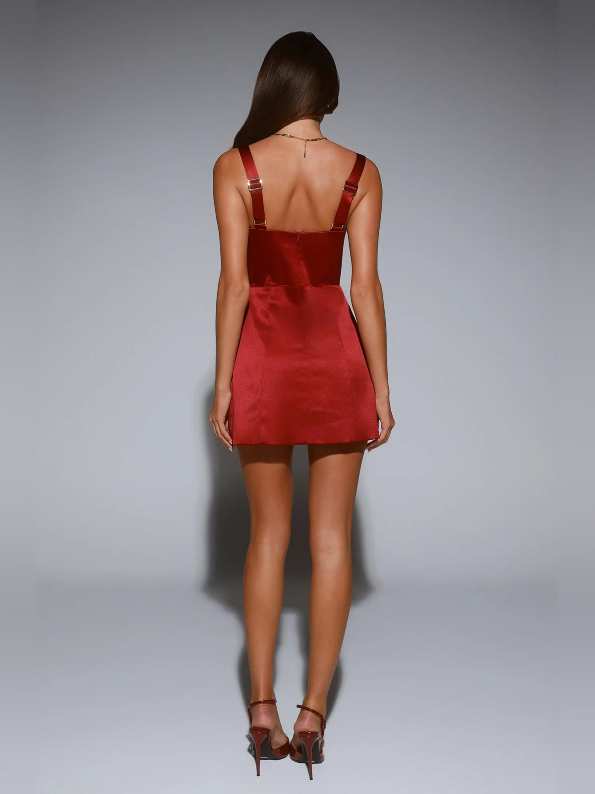 Red satin mini dress back view, open back with thin strap accents