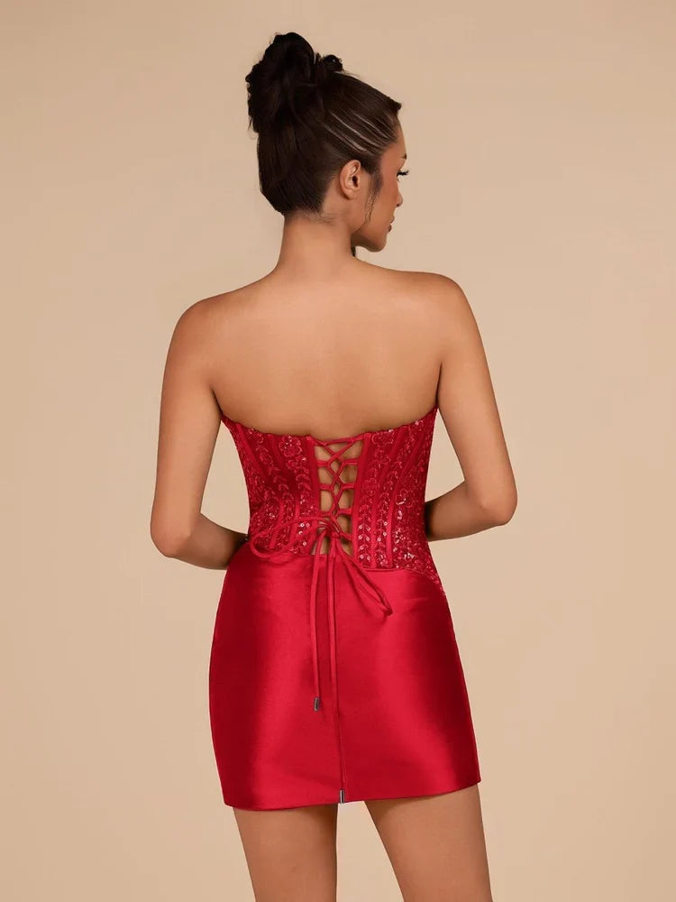 Red satin strapless mini dress with ruched corset front and lace-up open back detail