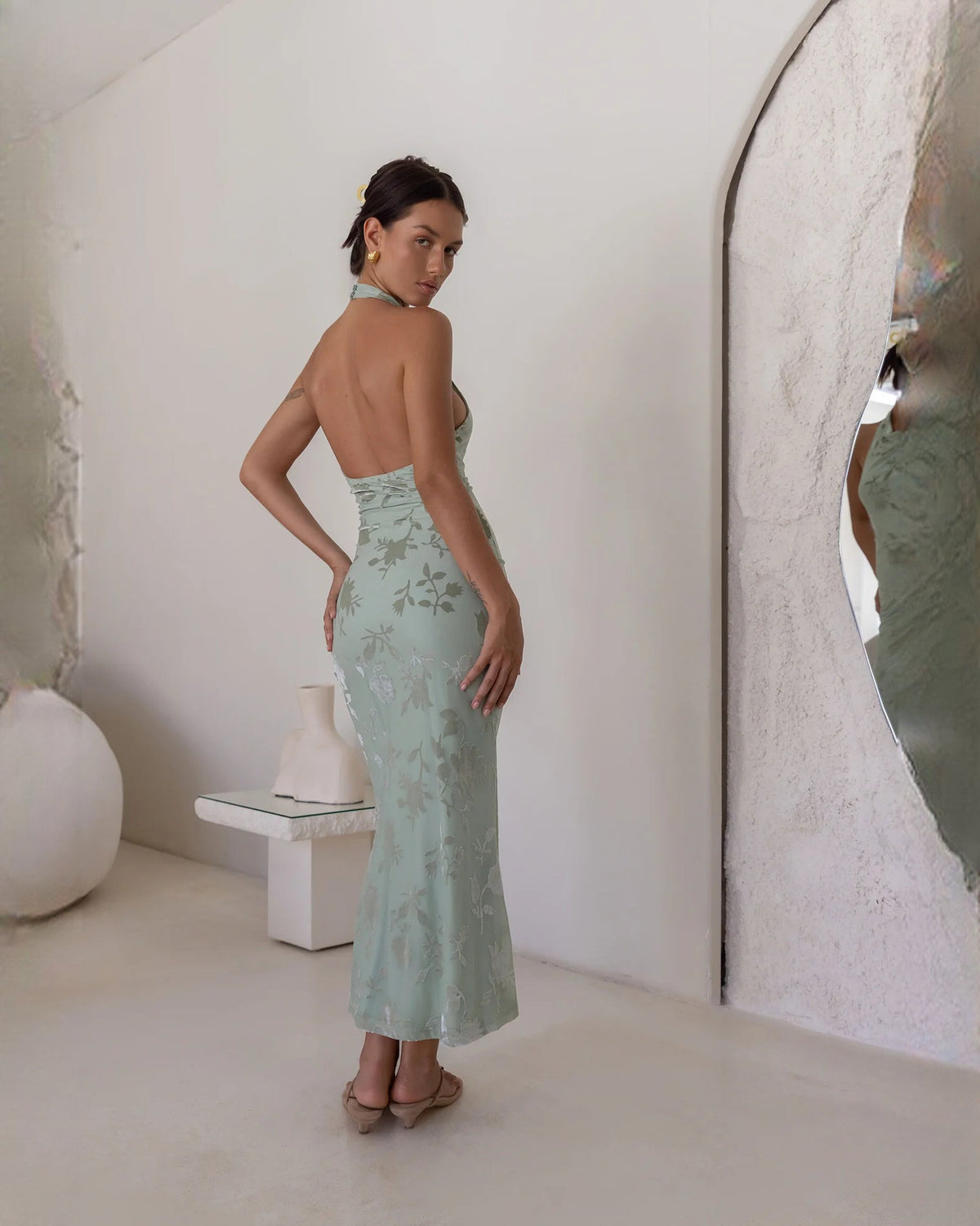 Dusty sage floral sleeveless halter A-line maxi dress, side and back angle