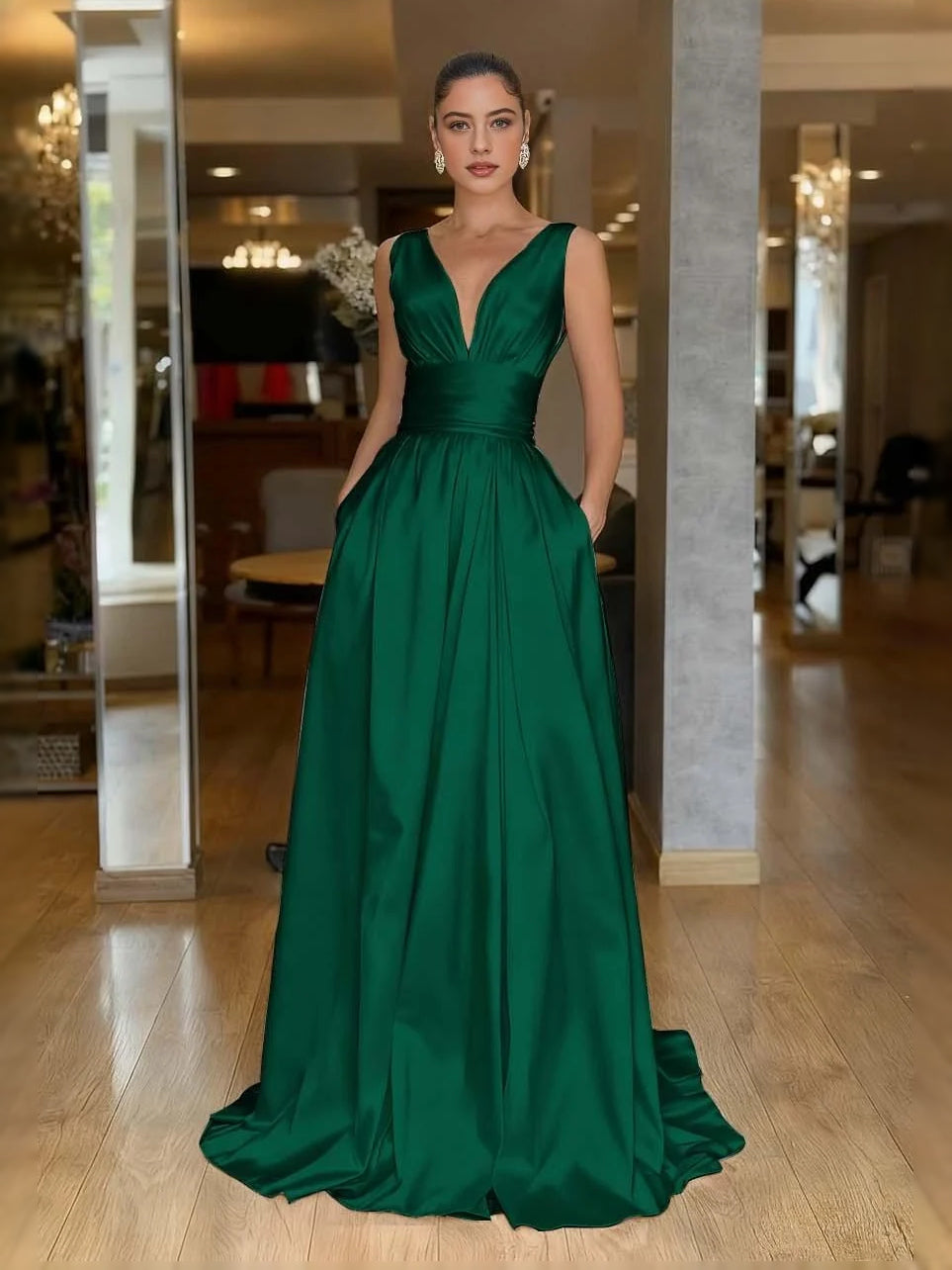 Emerald green V-neck A-line prom dress with ruched pleats, sleeveless floor-length skirt