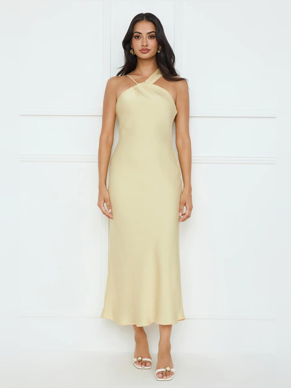 Pale yellow satin midi dress with halter neckline and smooth straight skirt
