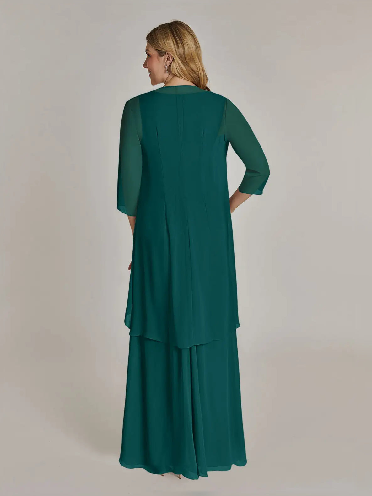 Peacock green chiffon maxi dress, back view, layered skirt and draped cape sleeves