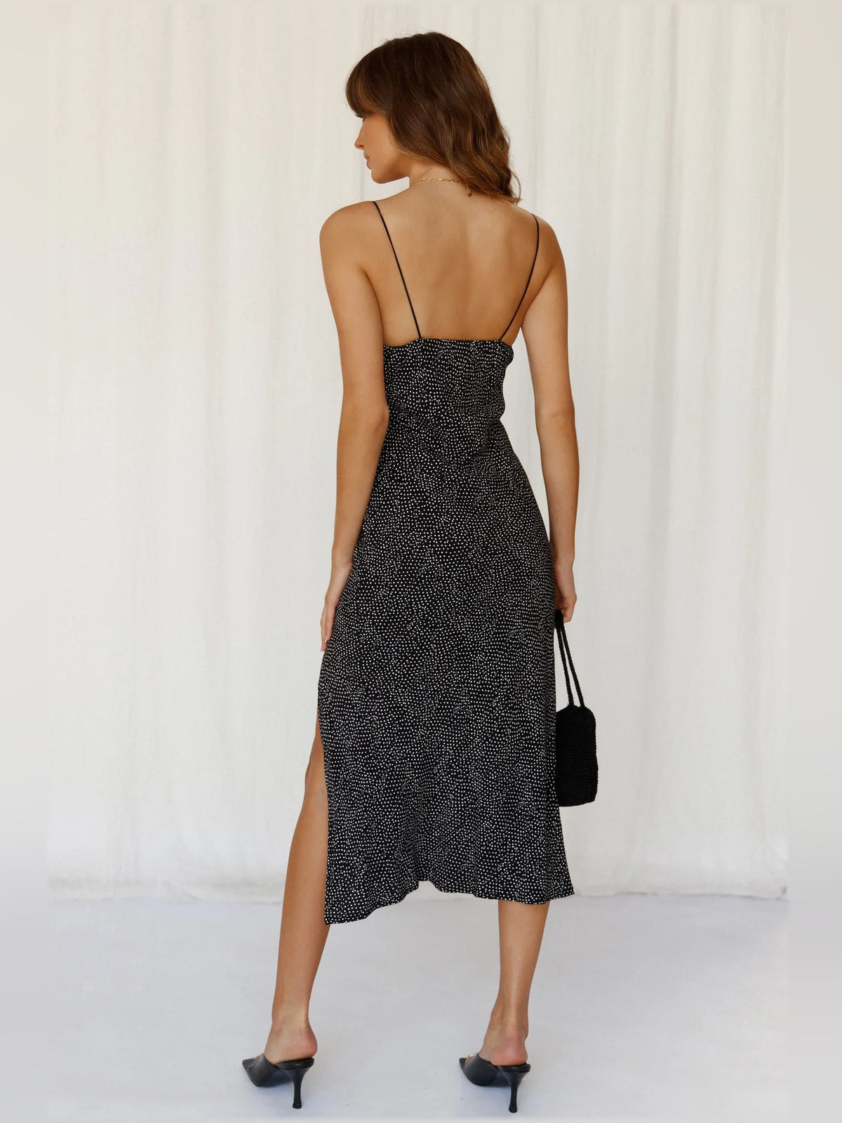 Black midi formal dress back view with thin straps and V-shaped back