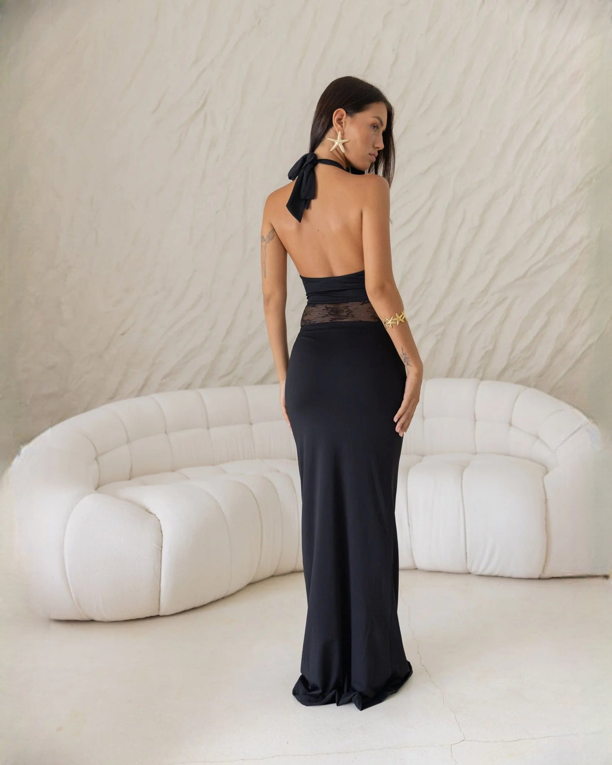 Black satin halter maxi dress with tie-back and lace midsection panel