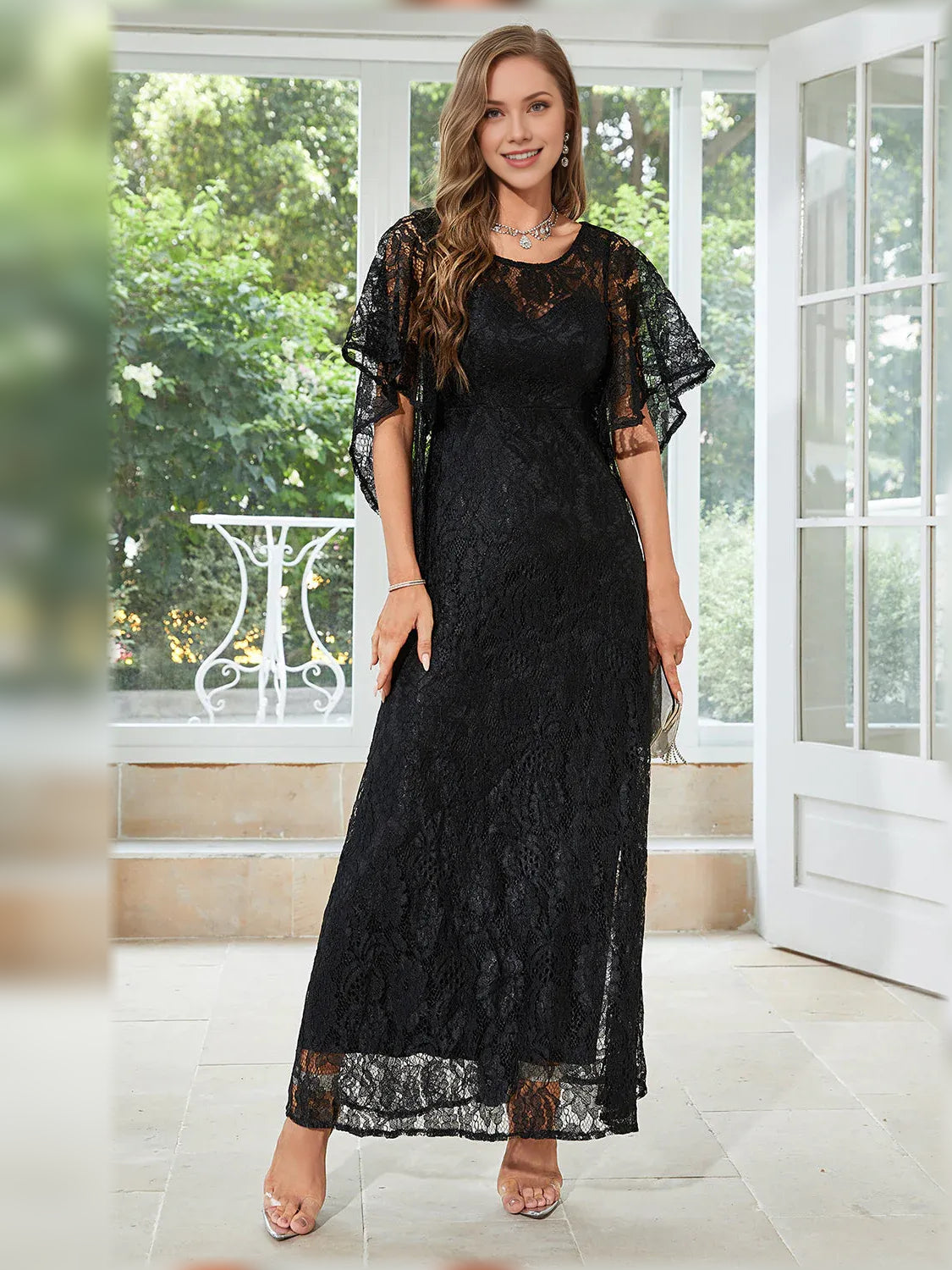 Black lace A-line formal dress with crew neckline and flutter sleeves, full-length skirt