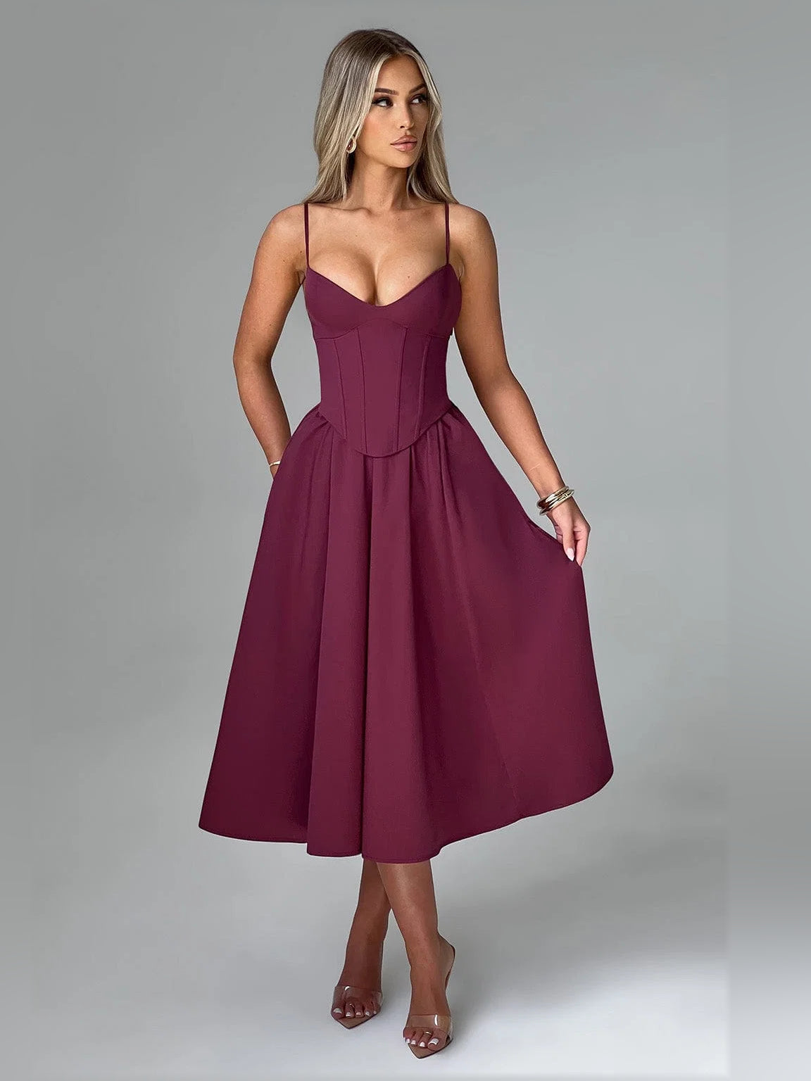 Cherry midi formal dress front view with spaghetti straps, sweetheart neckline, boned corset bodice, pleats