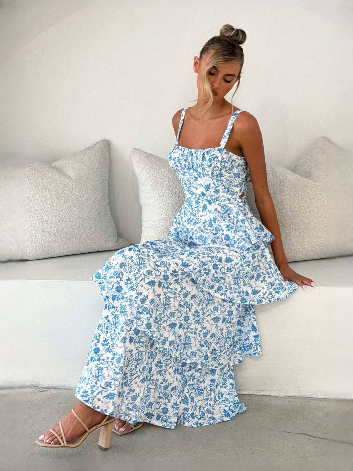 Blue floral tiered midi dress with layered skirt and spaghetti straps