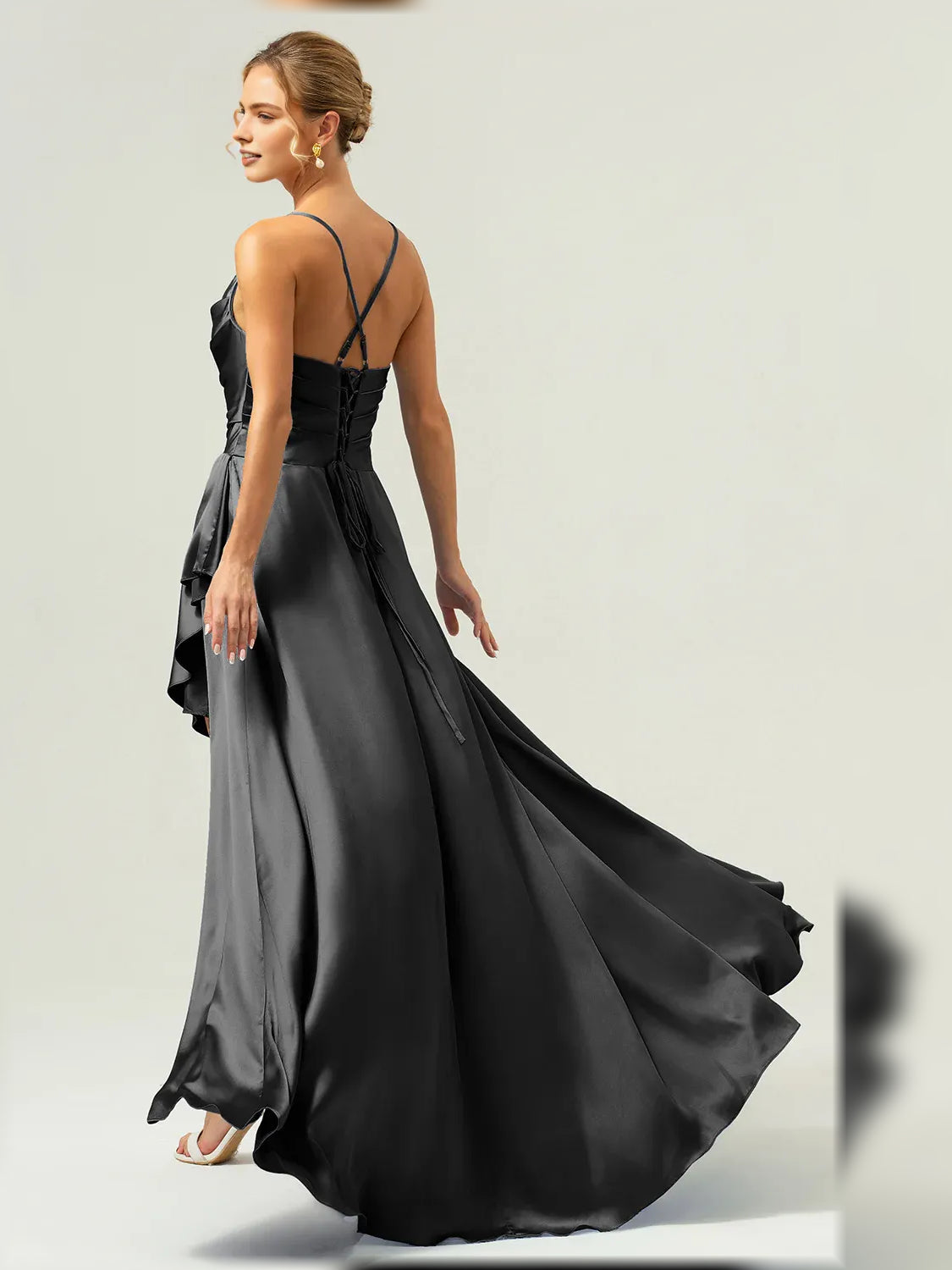 Black formal satin maxi dress with cowl bodice, spaghetti straps, and draped ruffle slit