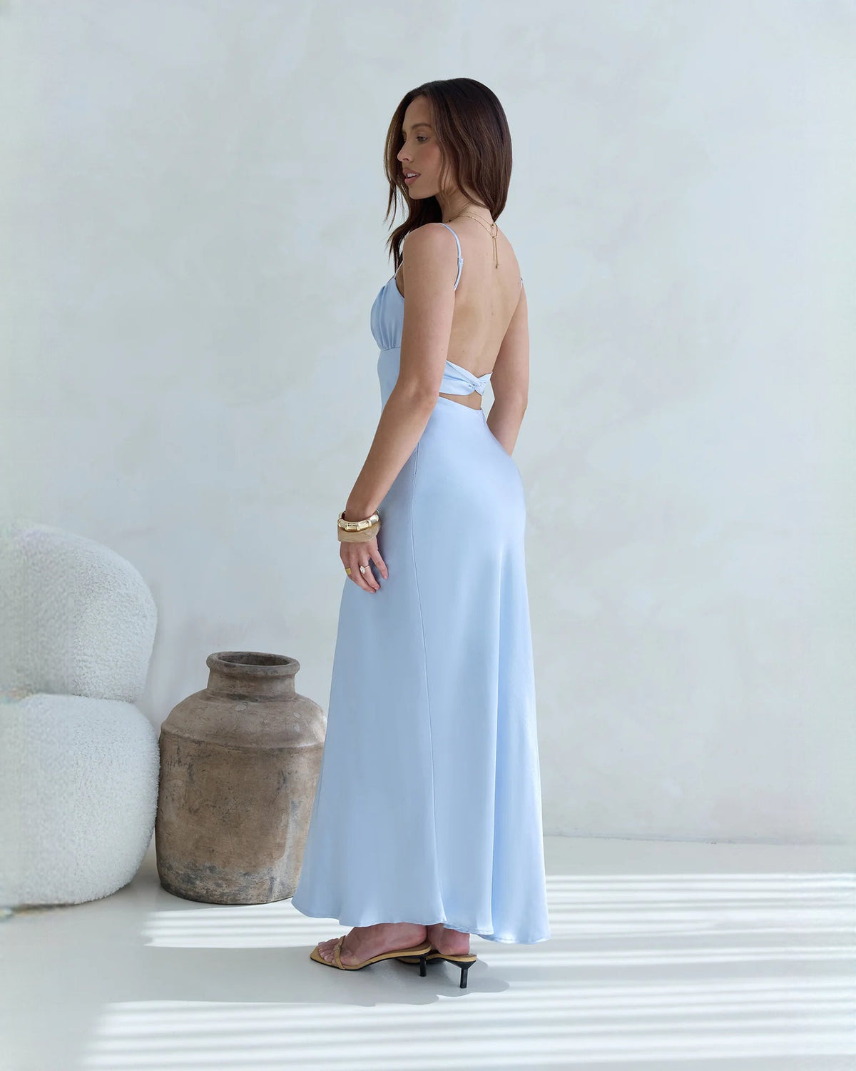 Light blue satin maxi bridesmaid dress, open-back style with thin straps